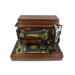 A Singer sewing machine in wooden case