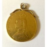 A Victorian 22ct gold £5 coin with unmarked mount. Total weight 39.8g