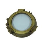 A brass hinged porthole stamped Woods Ltd. Rainhill and 11382