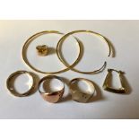 A collection of both hallmarked gold and gold coloured items, including a gold tooth, 9ct rings,