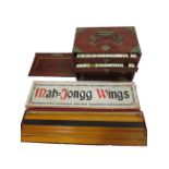An early 20th century Mahjong set, made with bone and bamboo, fitted within a small hard wood