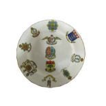 A tea plate decorated with various crests, Royal Flying Corps,Scots Guards, Life Guards etc.with the