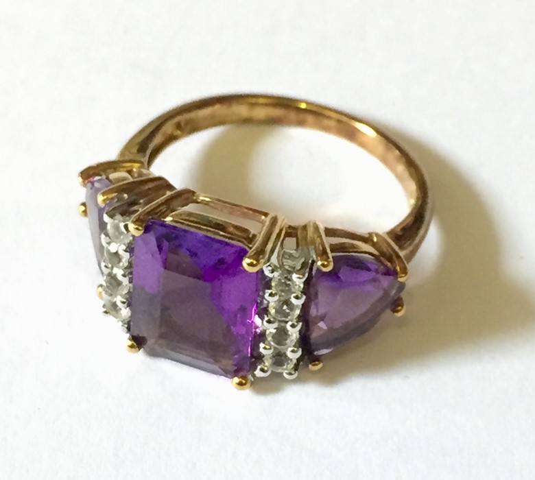 A 9ct gold amethyst and diamond dress ring.