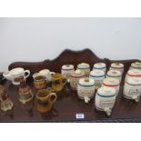 A collection of Wade including pottery barrels, bells etc
