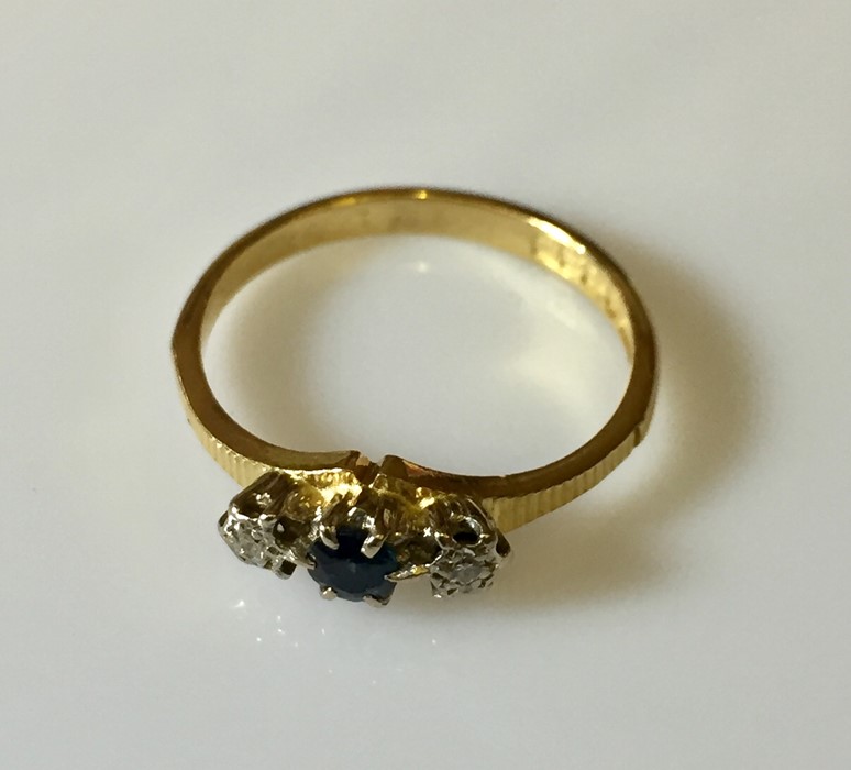 An 18ct gold ring with sapphire and diamonds. - Image 2 of 3