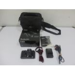 A Canon Powershot G5X in box along with a cameras bag, charger etc