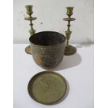 A pair of brass candlesticks, John Bull brass dish along with an Eastern brass pot decorated with