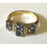 A 9ct gold diamond and sapphire dress ring.