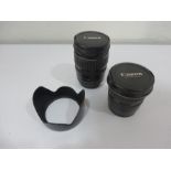 A Canon EF 28-135mm 1:3.5-5.6 Ultrasonic lens and Canon 20-35mm 1:3.5-4.5 Ultrasonic lens