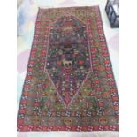 An Eastern rug with geometric design 205cm x 110 cm