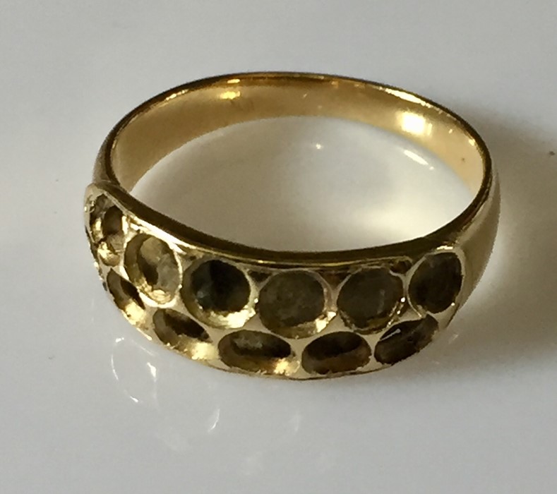 An unmarked ring, possibly 18ct - 2.6g