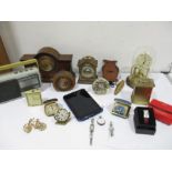 A collection of clocks, watches, radio, tablet etc.