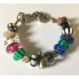 A 'Trollbeads' 925 silver bracelet with 17 charms