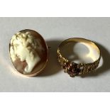 A 9 ct gold ring set with garnets, 1.7g, along with a 9 ct gold cameo brooch/pendant