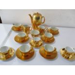 A Royal Worcester part gold coloured tea and coffee set