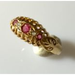 An 18ct gold ring with rubies and diamonds.