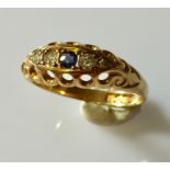 An 18ct gold ring with sapphire and diamonds.