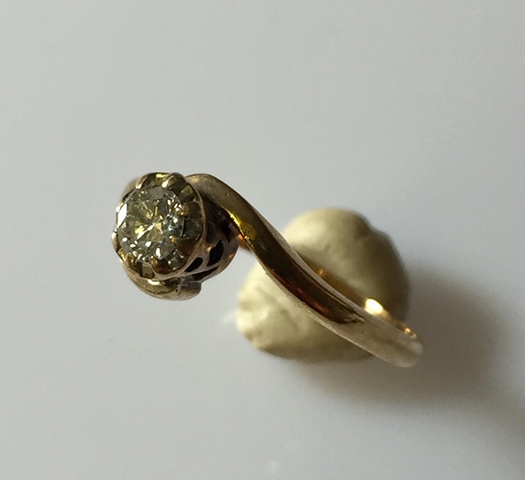 An 18ct gold diamond solitaire.