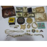 A collection of costume jewellery, compacts etc.