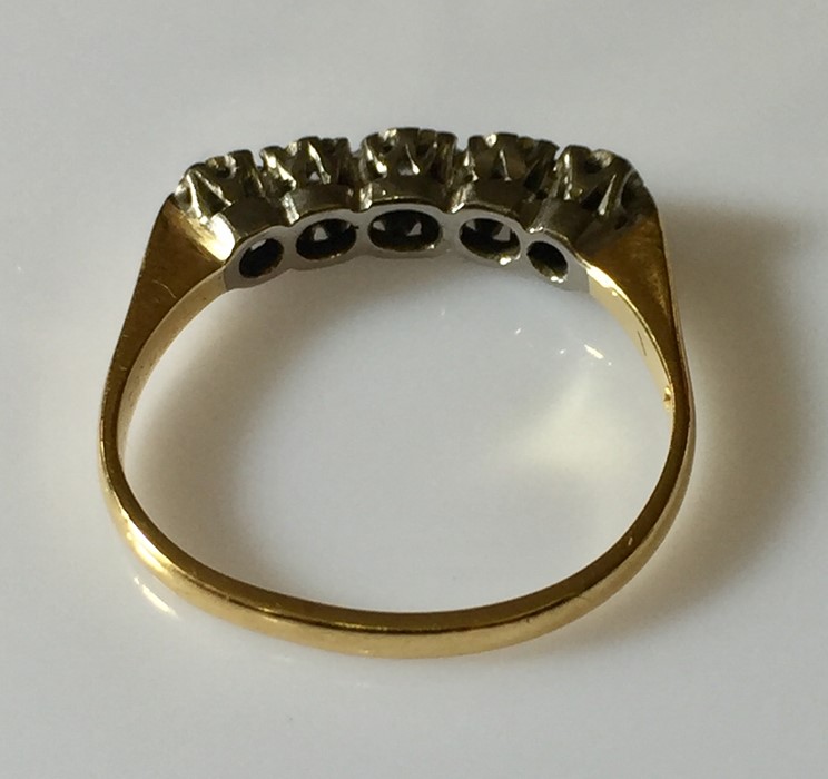 an 18ct gold ring with 5 diamonds. - Image 4 of 4