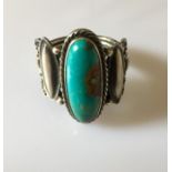 A silver and turquoise ring - Navajo Indian design.