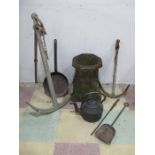 A weathered chimney pot, two anchors, cast iron kettle etc.