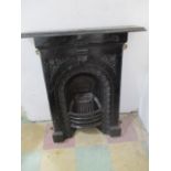 A Victorian cast iron fireplace