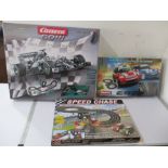 A Carrera Go!! "Silver Stars" slot car racing game along with two others, Downtown Racers and