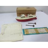 A vintage Sutcliffe 'Jupiter Ocean Pilot Cruiser ' tinplate clockwork model boat with two keys,