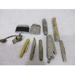 A collection of pen knives, lighters etc including a hallmarked silver penknife and 1945 penknife