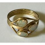 A 9ct gold ring with 3 opals.