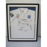 A 2009/10 England football shirt, framed and signed by various members of the team including Rooney,