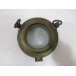 A small brass porthole