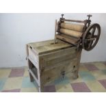 An antique pine washing machine & mangle by Harper Twelvetrees Ltd, London