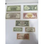 A collection of WWII Japanese Govt. issue banknotes from $1000- 50 cents, some stamped MP