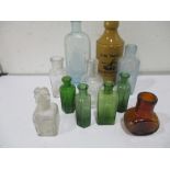 A small collection of various bottles including The Yacht Beverage Co. Exeter