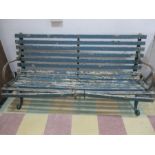 A garden bench with wrought iron ends A/F