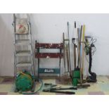 A collection of garden tools, Black & Decker work mate, step ladders etc