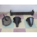 A cast iron fender, boot scraper and two gutter hoppers