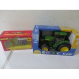 A boxed Bruder John Deere 1:16 model tractor along with a Britains IFOR WIlliams Horse Trailer