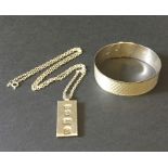 A hallmarked silver bracelet along with a silver ingot pendant and chain. Total weight 31.6g