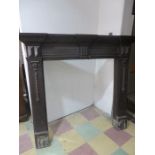 A large oak fire surround