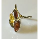 An amber 'triple' ring in silver