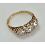 A good 18ct gold diamond ring, the centre stone approx 0.75ct, flanked by 2 diamonds of approx 0.