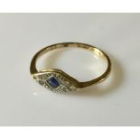 An 18ct gold Art Deco ring with square cut sapphire and diamonds.