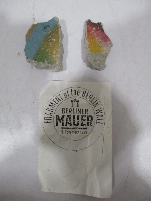 Two fragments of the Berlin Wall, 1989, largest 5.5 cm x 4 cm approx