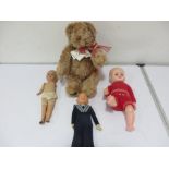 A Canterbury bear along with three vintage dolls