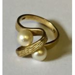 A 9ct gold ring with pearls.