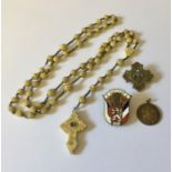 A Rosary with a stanhope of Lourdes, a SCM brooch, badge etc.