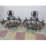 A pair of large wrought iron eight branch candleabra